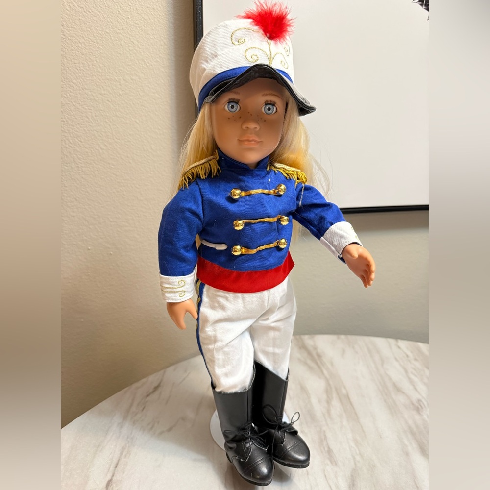 Our Generation Battat blonde blue eyes doll in a matching band uniform
